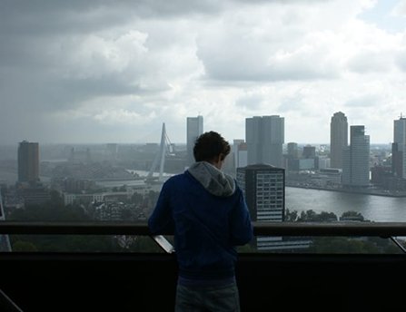 Young man looking at the city skyline